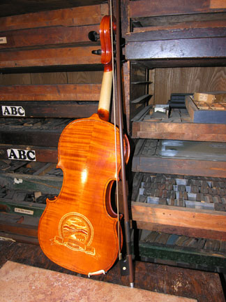 Reverse view of Hand-carved fiddle